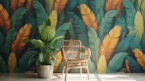 A rattan chair and a potted plant sit in front of a vibrant wall covered with a bold tropical leaf pattern in green, yellow, and teal hues. Sunlight streams across the floor, creating a bright, relaxed atmosphere.